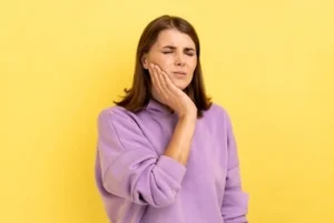 patient feeling tooth pain